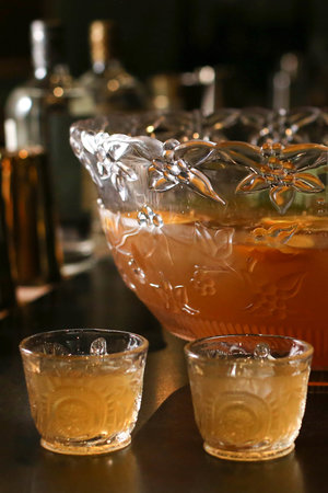 HOT EARL GREY PUNCH   32 oz Corgi Spirits Earl Grey Gin  32 oz fresh orange juice  16 oz fresh lemon juice  16 oz honey syrup (1 parts honey : 1 part water)  32 oz water  Cinnamon sticks, cloves, and lemon slices for garnish    Combine all ingredients in a crock pot and simmer on low. Serve in a mug with a lemon slice, cinnamon stick, and cloves to garnish.