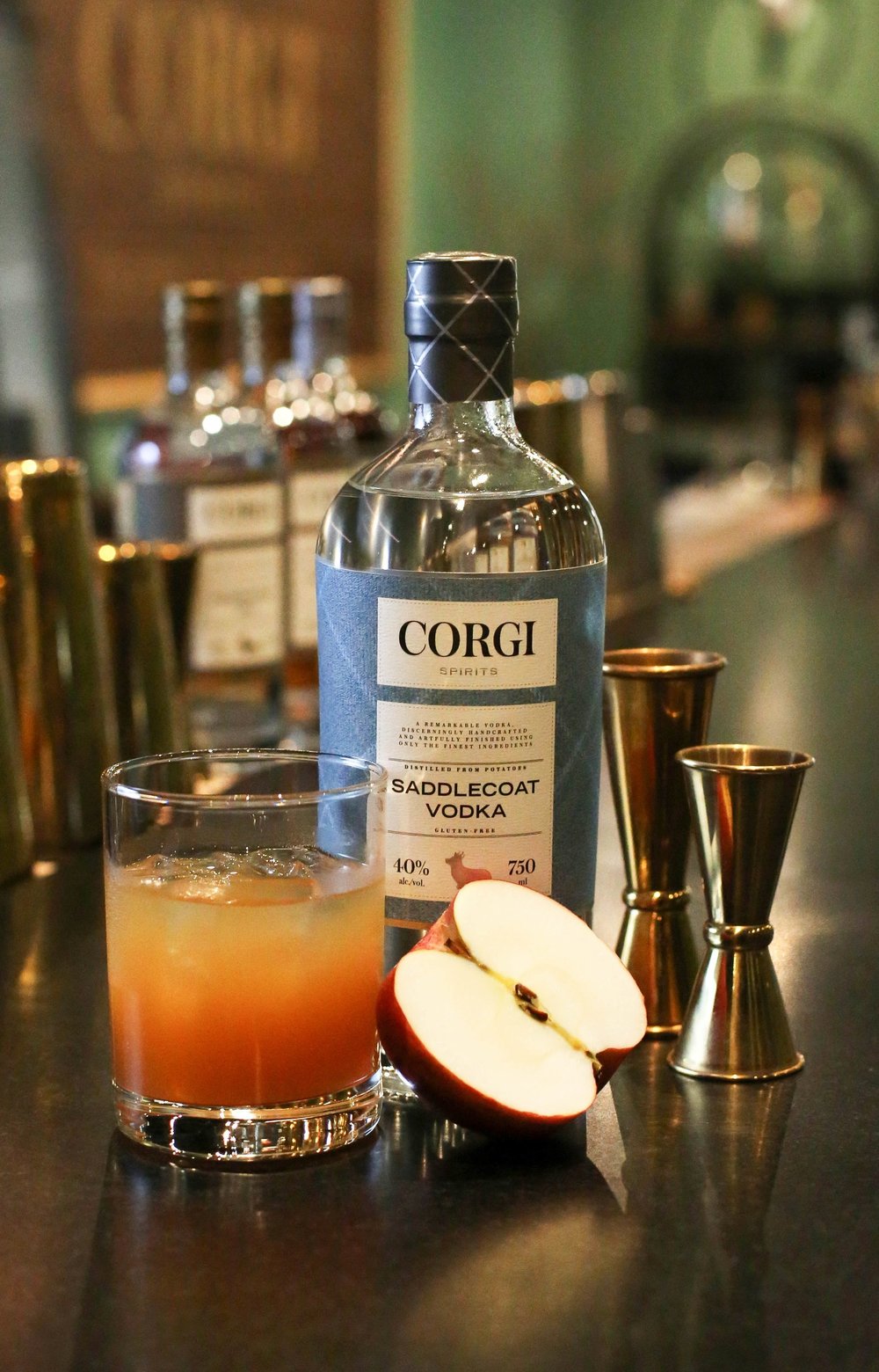 AUTUMN PAWS 2 oz Corgi Spirits Saddlecoat Vodka 0.5 oz fresh lemon juice 0.75 oz maple syrup 1.5 oz fresh apple cider 2 dashes Angostura bitters Apple slice for garnish In a cocktail shaker with ice, add all ingredients and shake vigorously. Strain into a rocks glass over fresh ice and garnish with an apple slice.