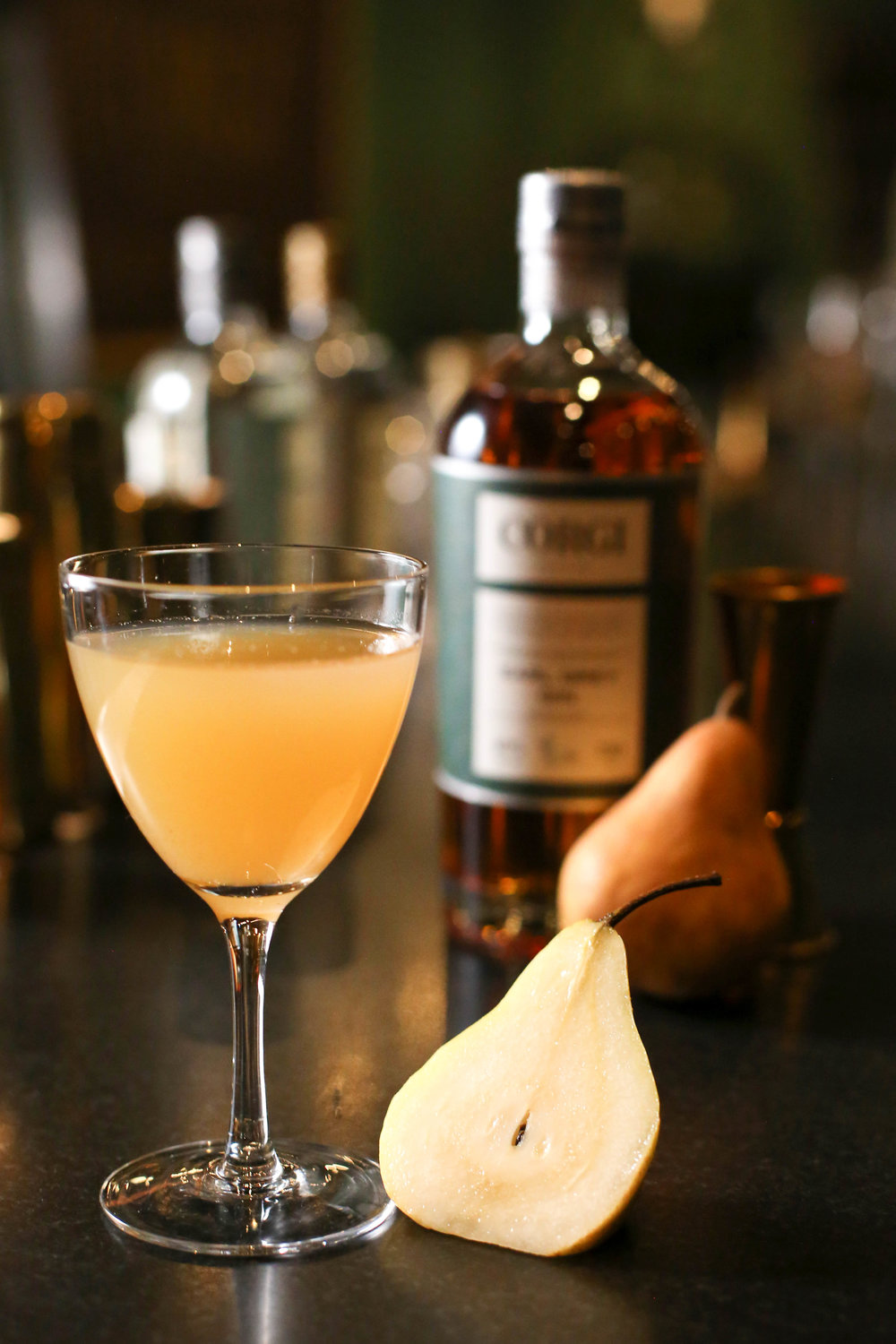 CHAMOMILES &amp; MILES AWAY   1.5 oz Corgi Spirits Earl Grey Gin  0.75 chamomile syrup (see below)  1 oz pear puree  0.5 oz fresh lemon juice  3 dashes orange bitters  Flower or pear slice for garnish    Fill a shaker with ice, add all ingredients and shake vigorously. Pour into a chilled cocktail glass. Add garnish.  To make chamomile syrup, combine 1 cup water with 1 cup sugar in a saucepan and bring to a boil. Remove from heat, add 5 tbs high quality dried chamomile flowers, stirring well to combine. Allow to cool, strain (pressing on solids), and reserve syrup.
