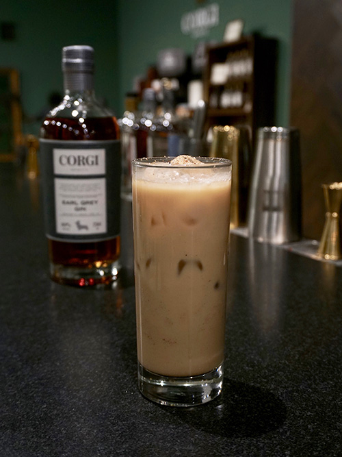 THE DUDE ABROAD 2 oz Corgi Spirits Earl Grey Gin 1 oz condensed milk 2 oz cold brew coffee 2 dashes Angostura Bitters Fill a shaker with ice, add all ingredients and shake vigorously. Pour into a highball glass and garnish with nutmeg.