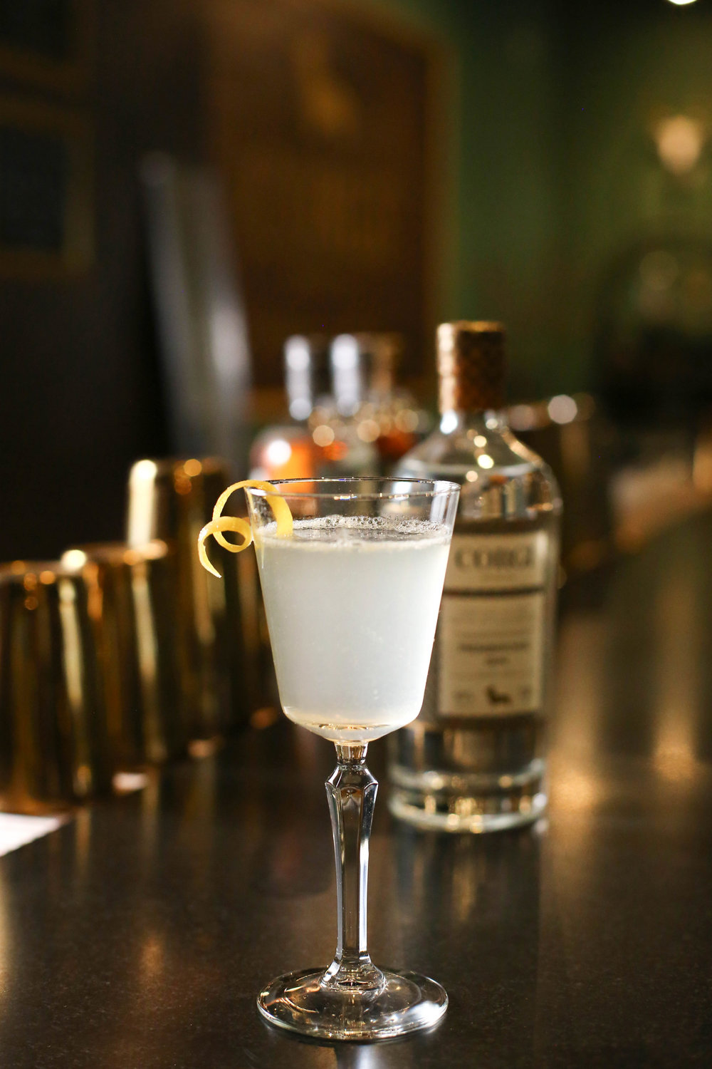 FRENCH 75   1oz Corgi Spirits Pembroke Gin  0.5 oz fresh lemon juice  0.5 oz simple syrup (1 part sugar : 1 part water)  Sparkling wine  Lemon twist for garnish    Fill a shaker with ice, add gin, lemon juice, syrup and shake vigorously. Strain into a chilled champagne glass and top with sparkling wine. Add lemon twist.