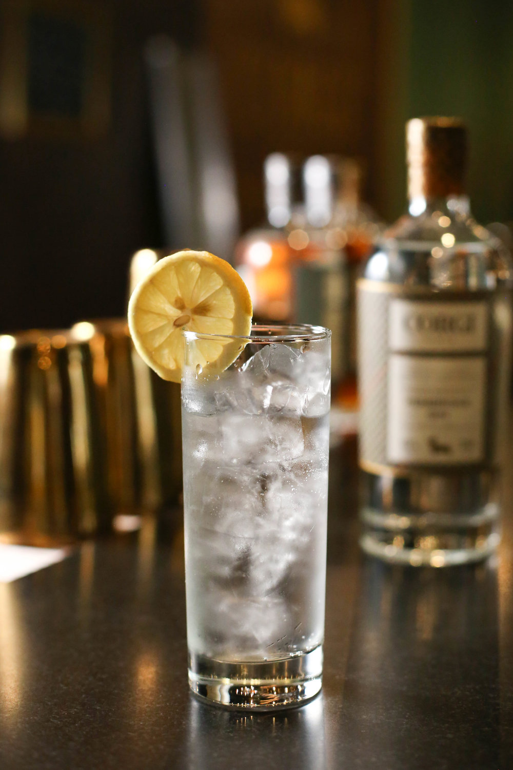 GIN & TONIC 2 oz Corgi Spirits Pembroke Gin 1 - 200mL bottle Fever Tree tonic water Lemon for garnish Fill a Collins glass with ice, add gin and stir to chill thoroughly. Pour tonic water into glass while gently stirring to combine. Add garnish.