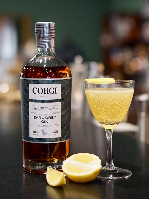BRIT 75 1 oz Corgi Spirits Earl Grey Gin 0.5 oz fresh lemon juice 0.5 oz simple syrup (1 part sugar : 1 part water) Sparkling wine Lemon twist for garnish Fill a shaker with ice, add gin, lemon juice, syrup and shake vigorously. Strain into a chilled champagne glass and top with sparkling wine. Add lemon twist.