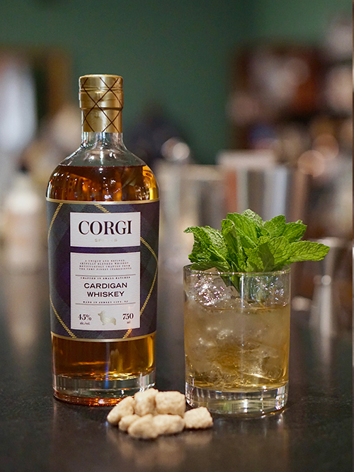 MINT JULEP   2 oz Corgi Spirits Cardigan Whiskey  1 oz sweet vermouth  2 dashes Angostura bitters  1 dash orange bitters    Add all the ingredients into a mixing glass with ice, and stir until well-chilled. Strain into a chilled coupe. Garnish with a brandied cherry.