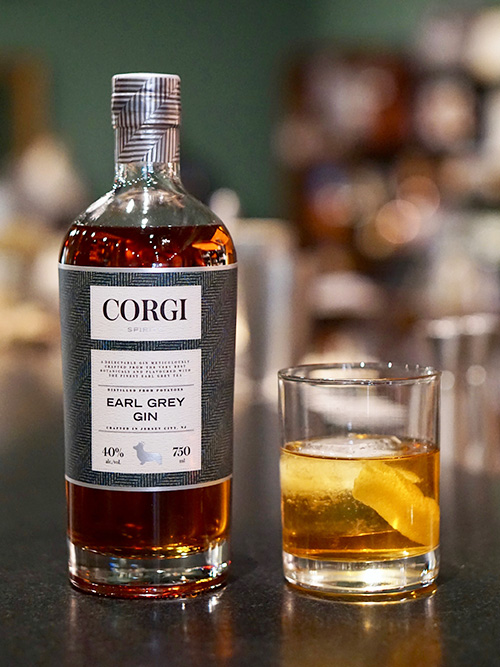 EARL GREY OLD FASHIONED   2 oz Corgi Spirits Earl Grey Gin  5 dashes Angostura bitters  1 demerara sugar cube  Orange peel for garnish    In a rocks glass, muddle sugar cube with bitters until dissolved. Add gin and a large ice cube. Stir to combine and to chill thoroughly. Express orange peel over top and garnish.